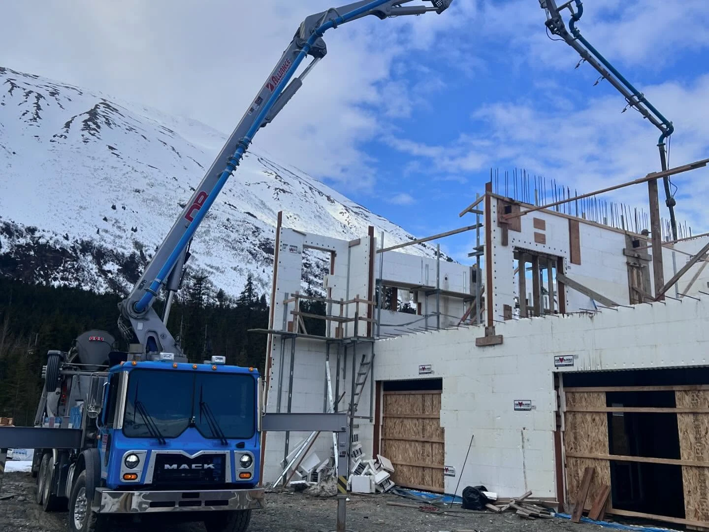 Davis Block trucks at remote Alaska mountain job site